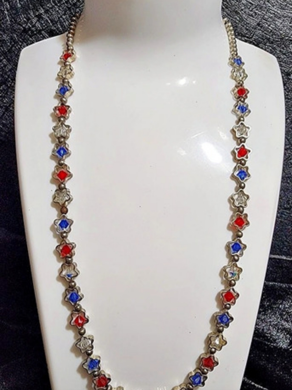 Vintage necklace with stars and stones in the center in red, white and blue.